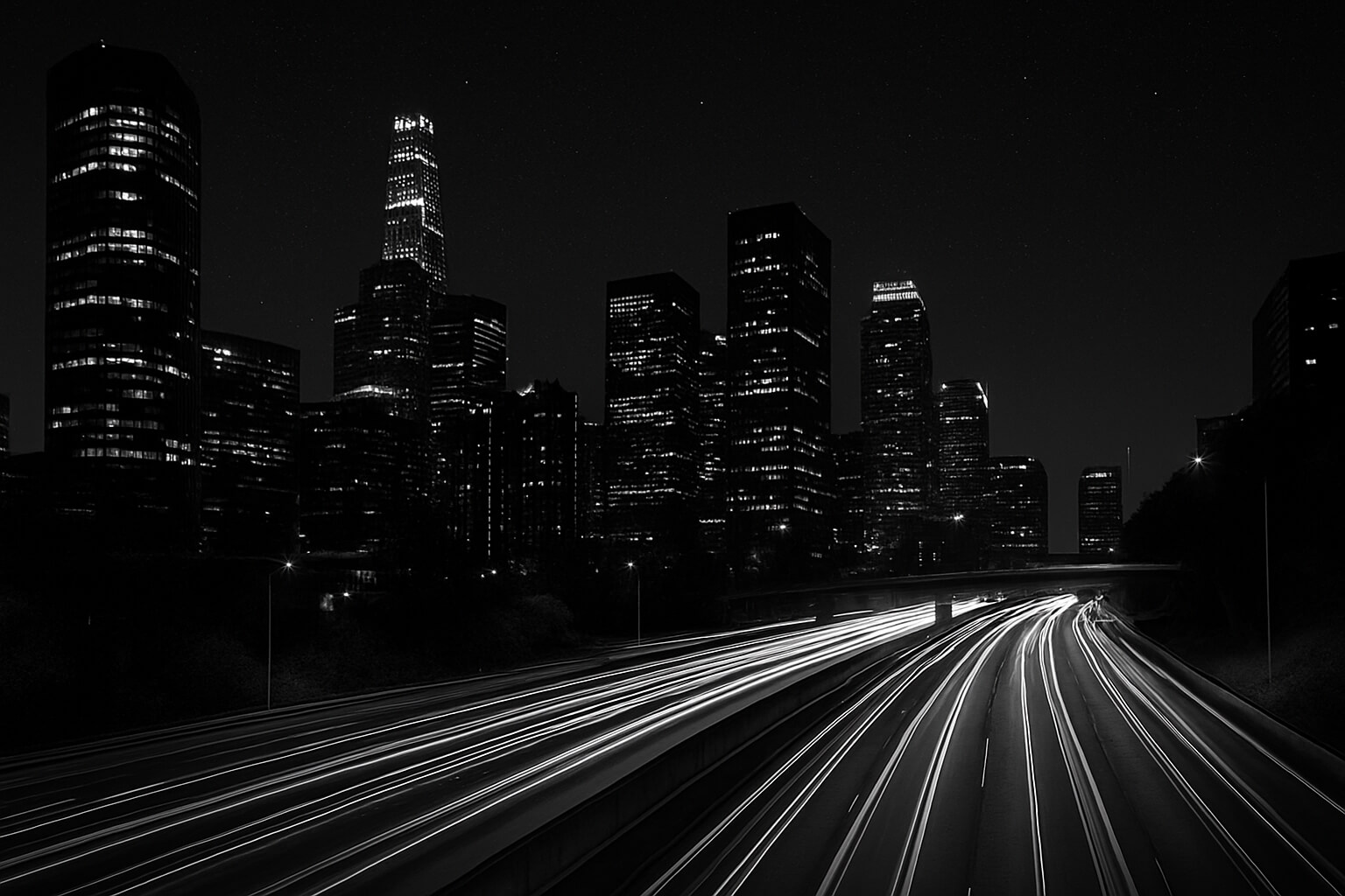 Long-exposure night cityscape with light trails and sharp stars in the sky.