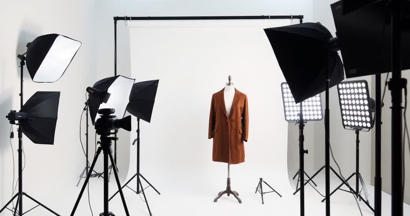 Professional clothing photography studio setup with softbox lighting and white background